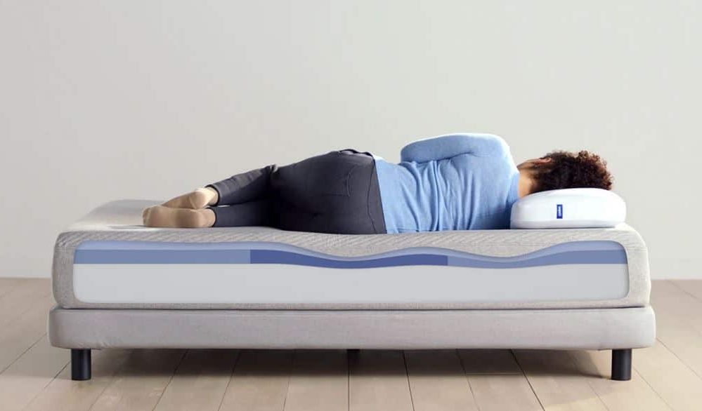 Woman on the edge of a Casper bed