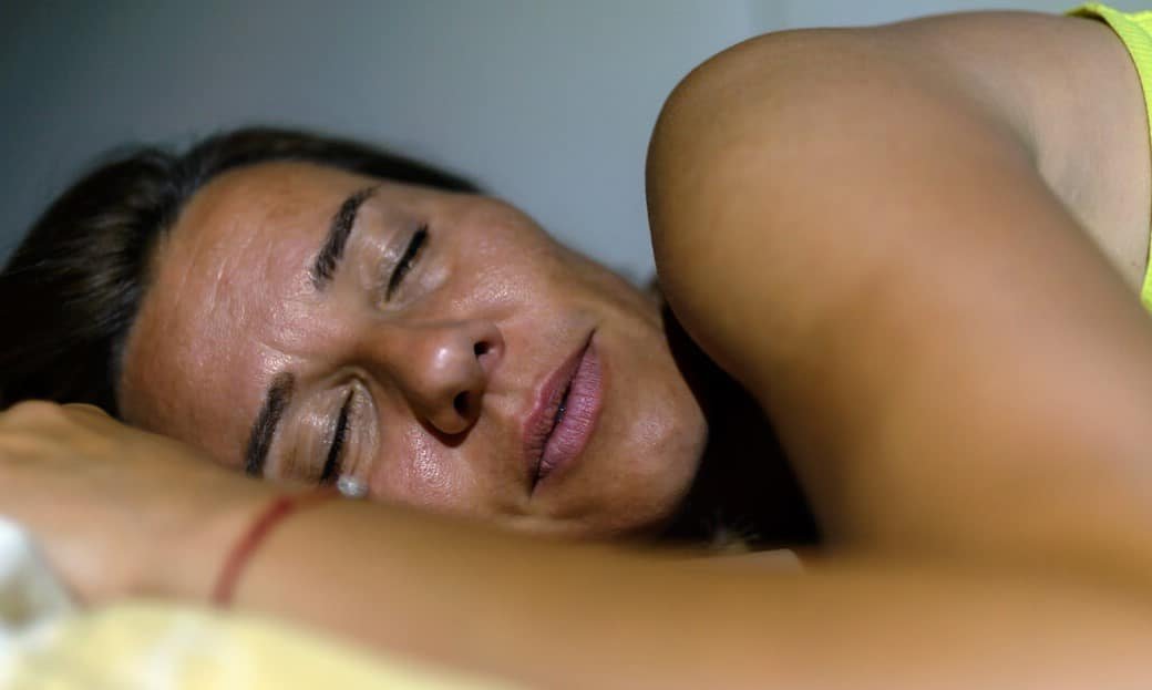 menopausal woman experiencing night sweats